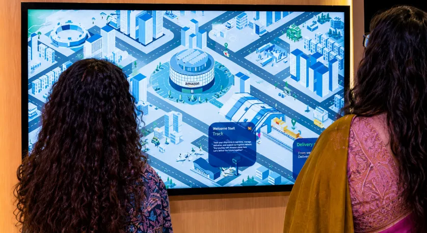 Interactive logistics experience displayed on a large digital screen