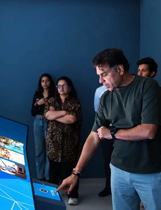 Visitor controlling Ajmera Manhattan’s immersive display through an interactive touch interface