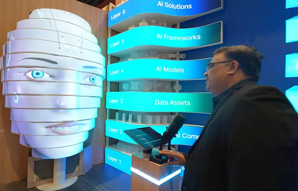 Visitor interacts with a Jio AI installation inside a technology exhibit